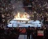 Powerbomb though flamming table Pictures, Images and Photos